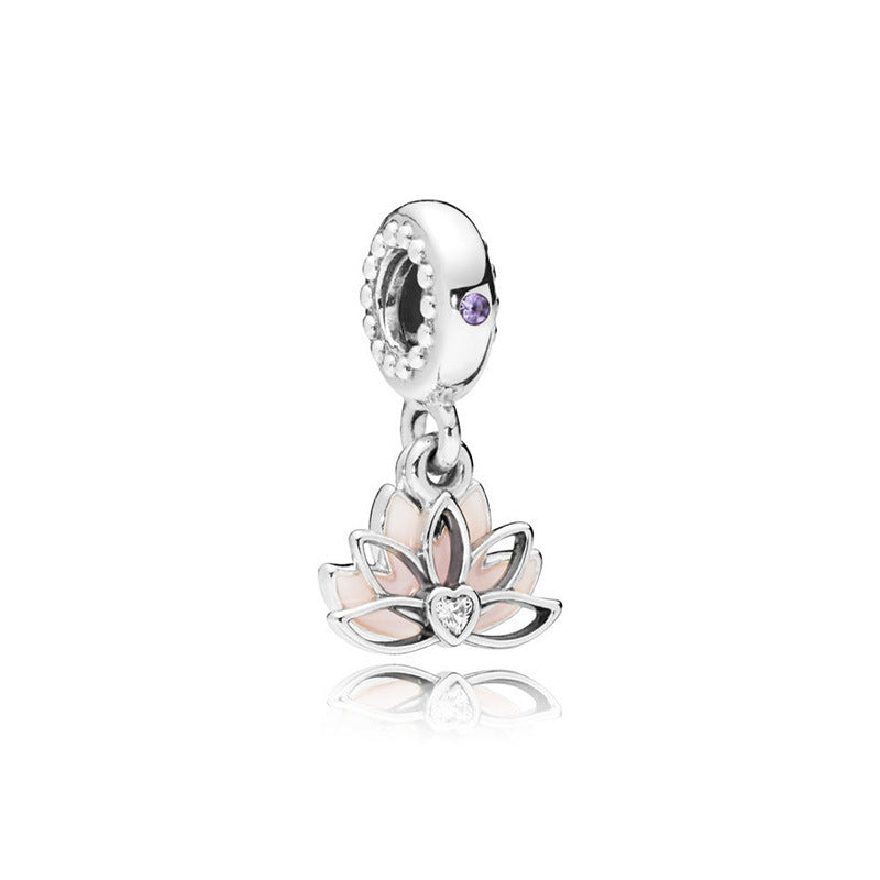 Silver charm with a pink lotus flower design on a white background