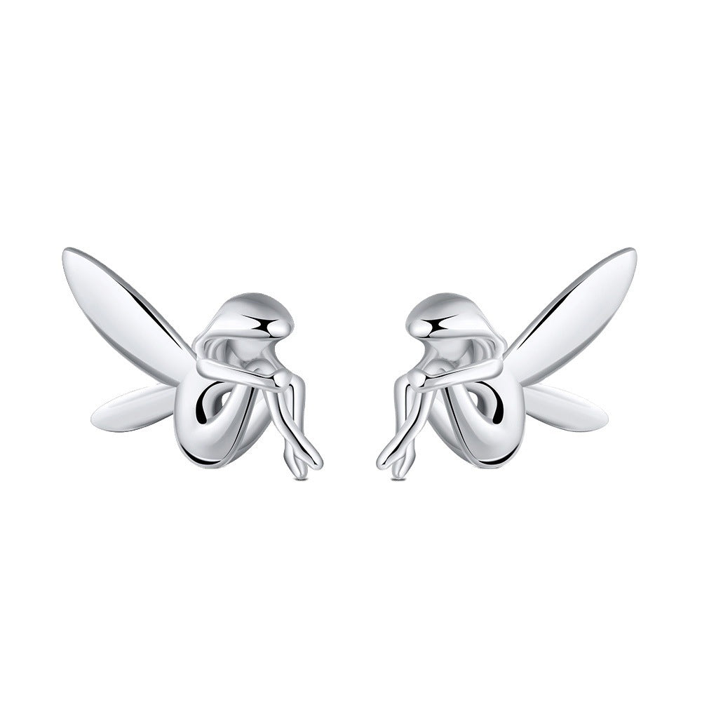 Silver fairy earrings on a white background