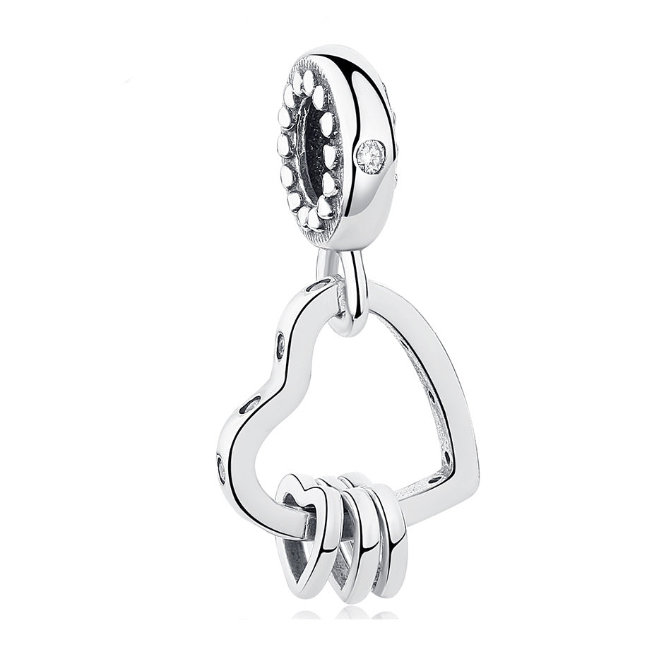 Silver heart-shaped pendant with a key design on a white background