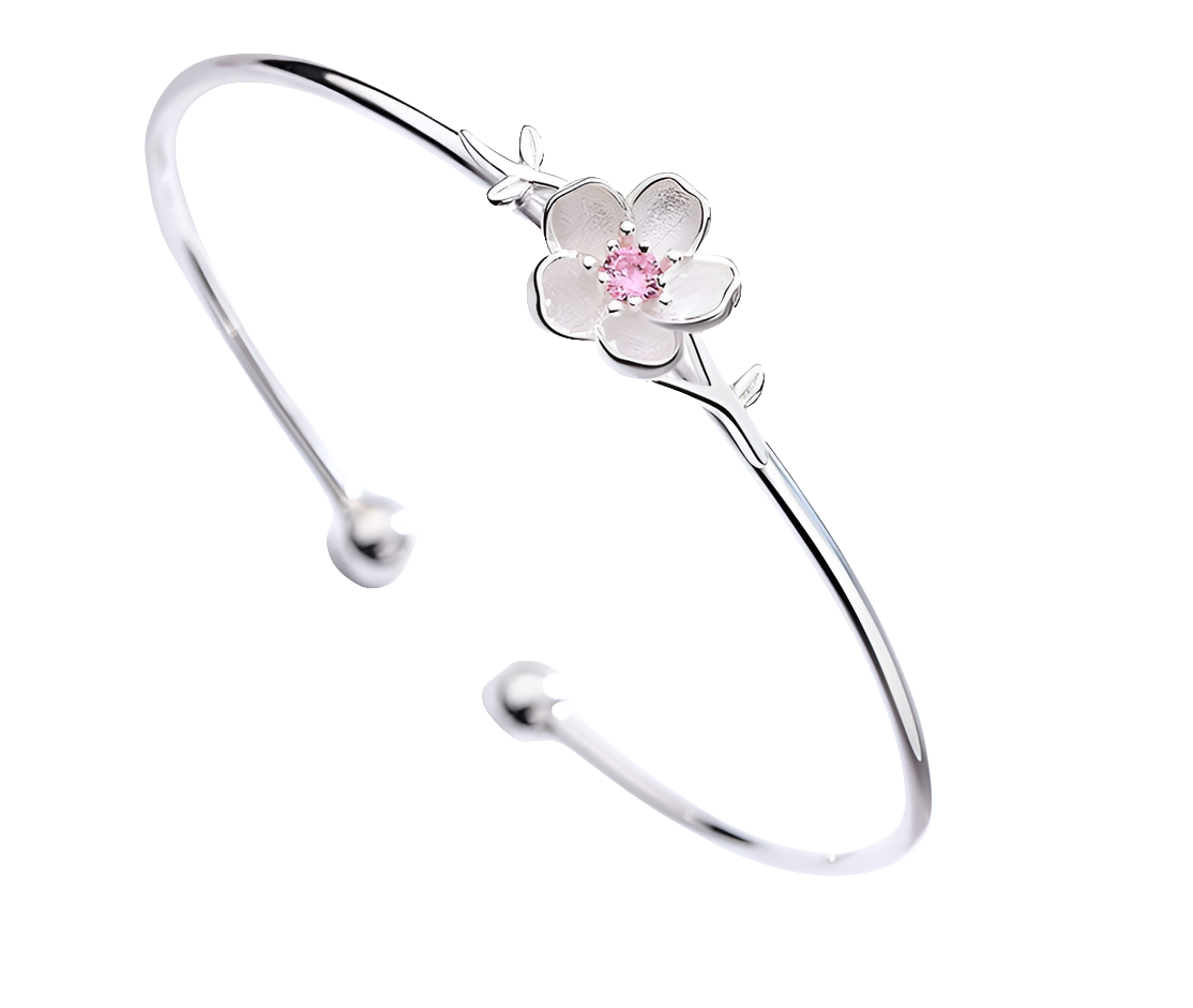 Silver bracelet with a floral design on a white background