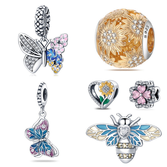 Sterling silver nature charms with butterfly, bee, flower and clover designs