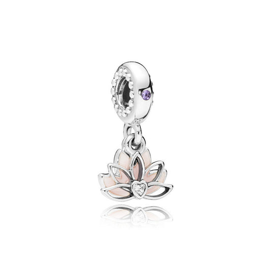 Silver charm with a pink lotus flower design on a white background