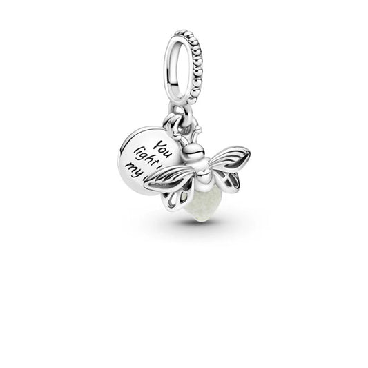 Silver bee charm with engraved text on a white background