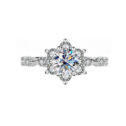 Diamond ring with a floral design on a white background