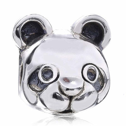 Silver panda charm on a white background