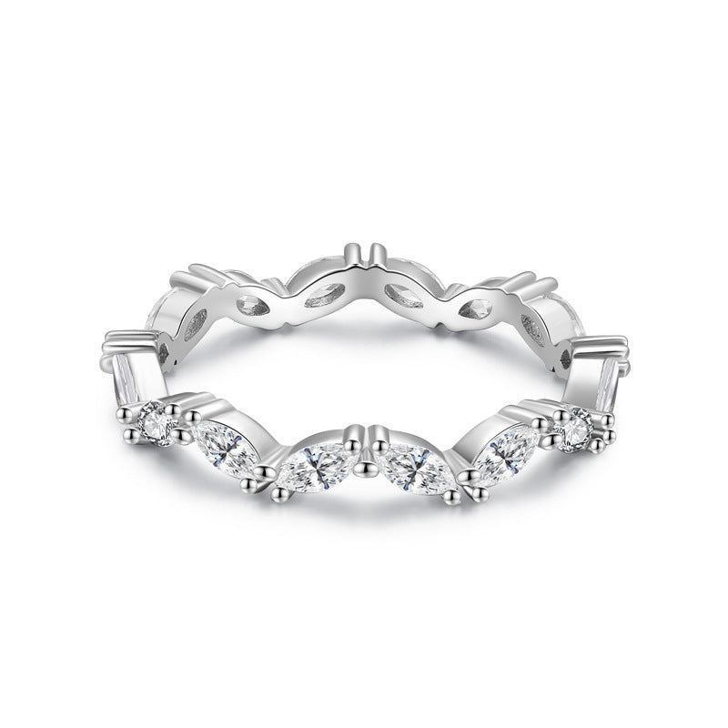Silver ring with diamond accents on a white background