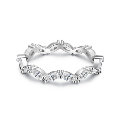 Silver ring with diamond accents on a white background