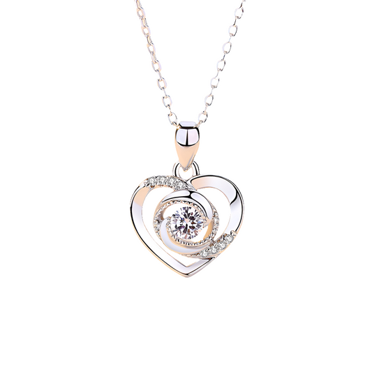 Heart-shaped pendant necklace with a diamond on a white background