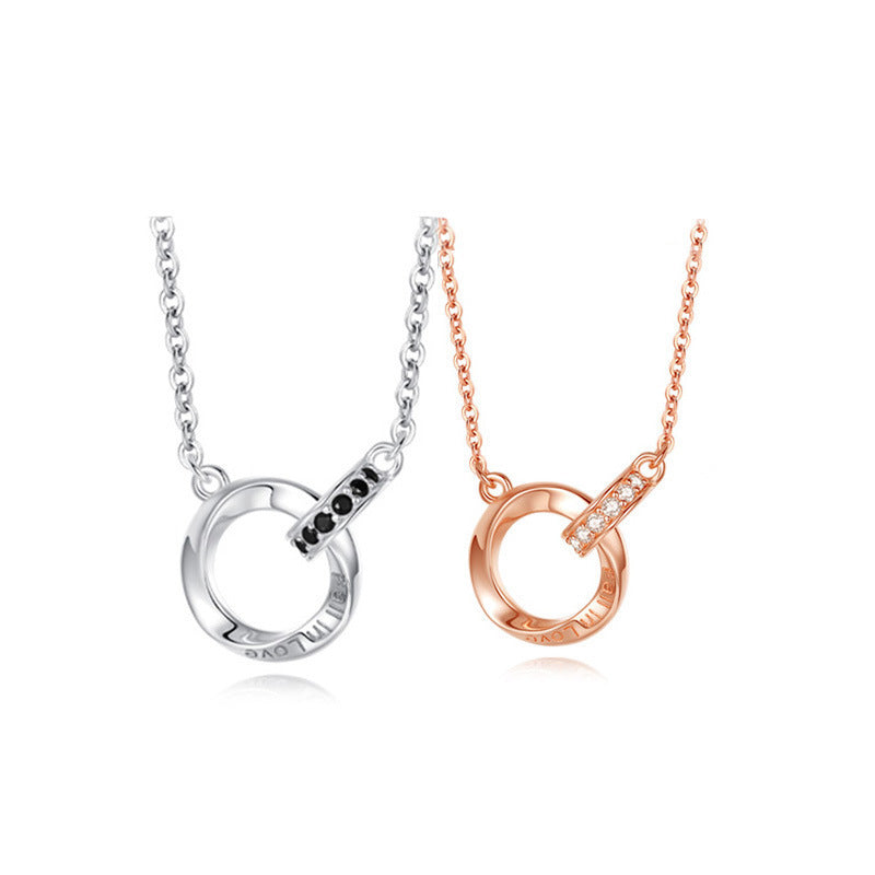 Two necklaces, one silver and one rose gold, on a white background