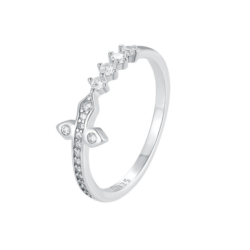 Silver ring with small diamonds on a white background