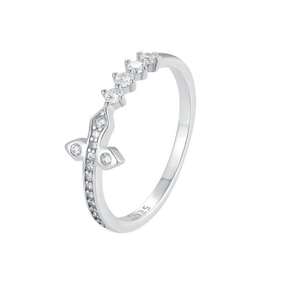 Silver ring with small diamonds on a white background