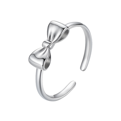 Silver bow-shaped ring on a white background