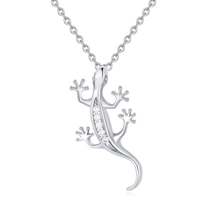Silver lizard-shaped necklace with embedded stones on a white background