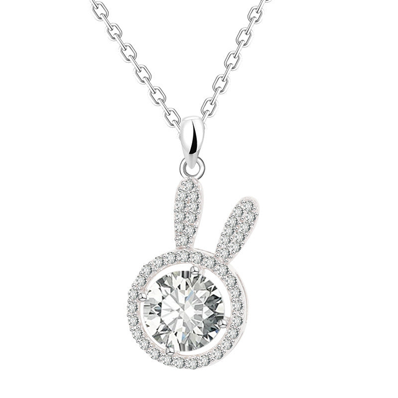 Silver necklace with a round diamond pendant on a white background
