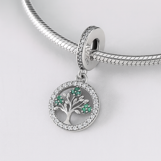 Tree of Life green crystal sterling silver charm shown on a bracelet